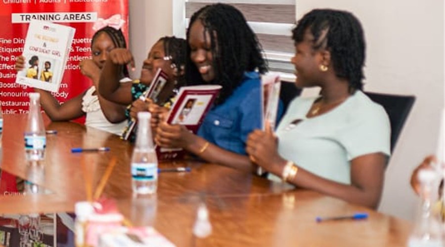 Participants seated around the table during an etiquette session.